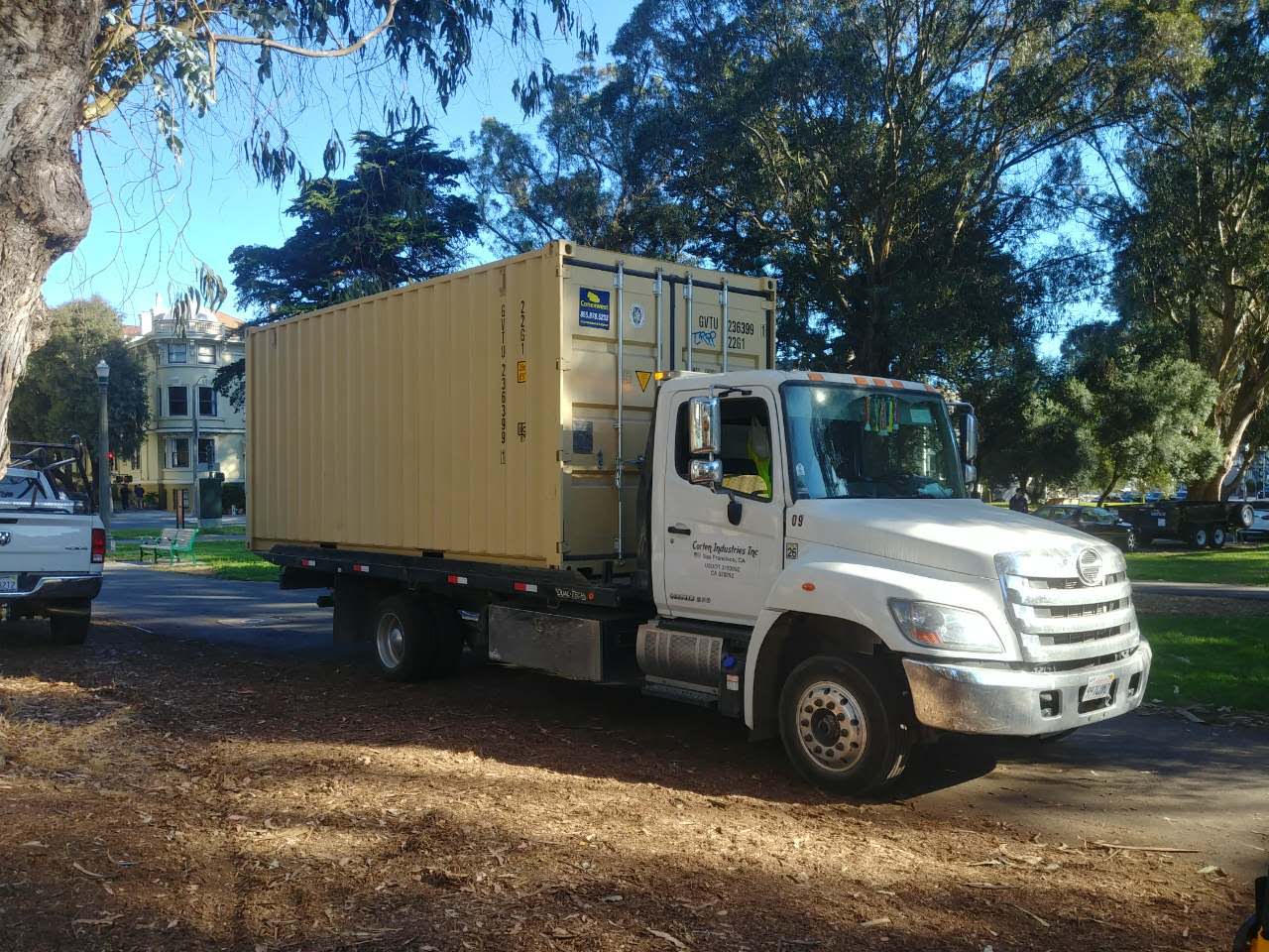 tilt bed truck shipping container delivery